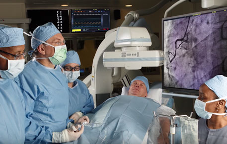 Surgeons in the operating room treating a coronary artery disease patient. 