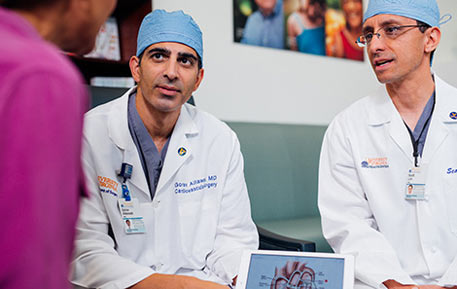 cardiovascular surgeons consulting with physicians