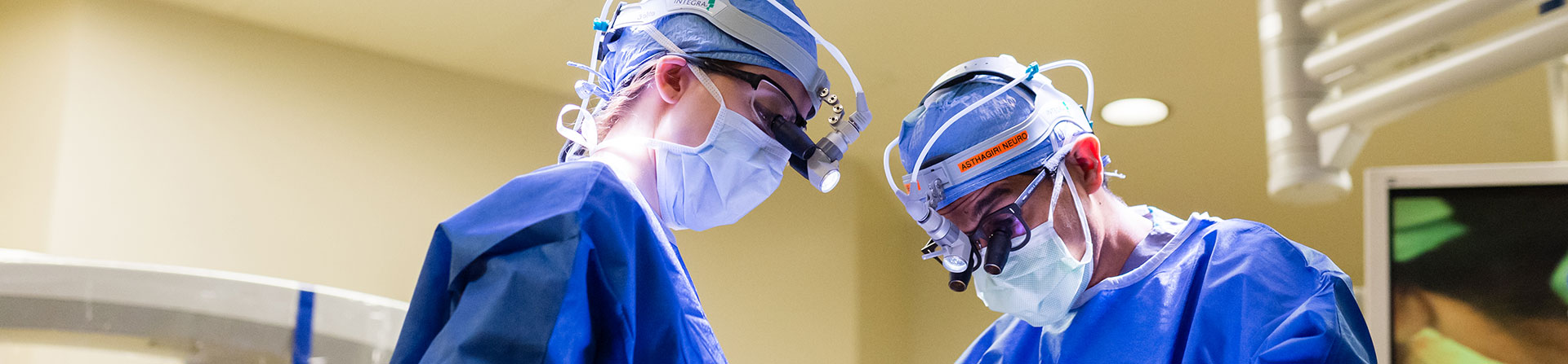 Two neurosurgeons using IMRIS to make sure they removed all of the affected brain tissue.
