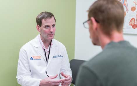 David E. Rapp, MD, consults with a patient about fertility issues.