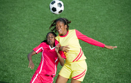 Female athletes playing soccer