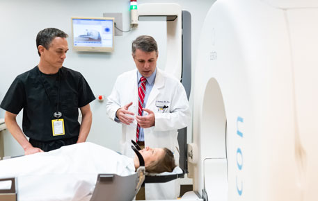 Two providers preparing a patient for a gamma knife procedure.