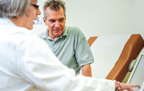 a patient discusses his disorder with one of our expert gastroenterologists