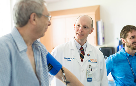 A healthcare provider discussing heart valve treatment options with a patient.