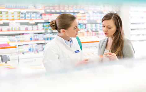 young woman talks to a pharmacist
