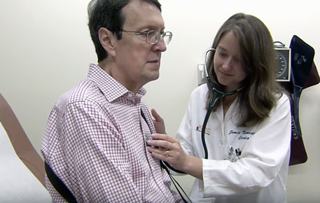 UVA Cardiologist checking a patient's heartbeat