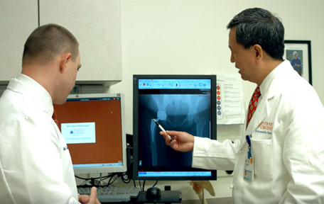 Physician reviewing hip x-ray