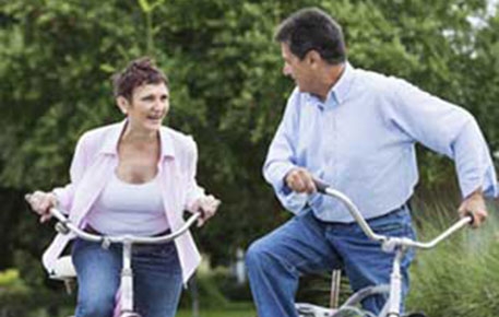 Man and woman riding bikes