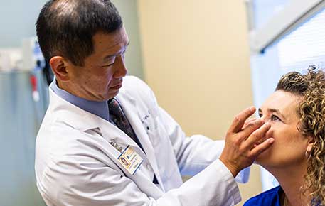 Dr. Park at UVA examines a patient with facial trauma