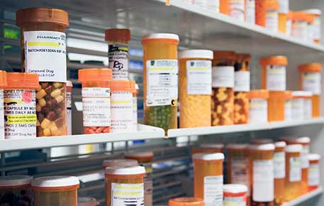 Discount medications on a pharmacy shelf